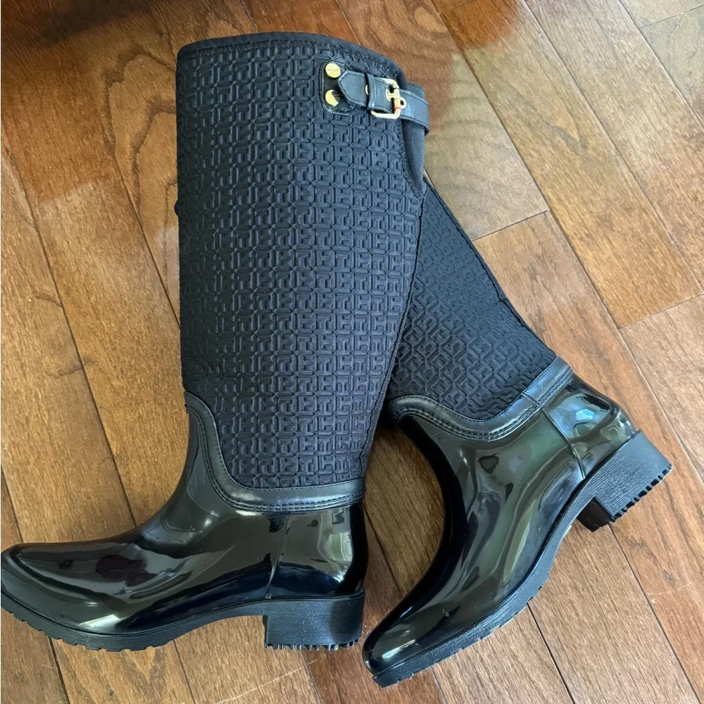 Tommy Hilfiger Black Boots. Gold accent hardware, logo embossed fabric.